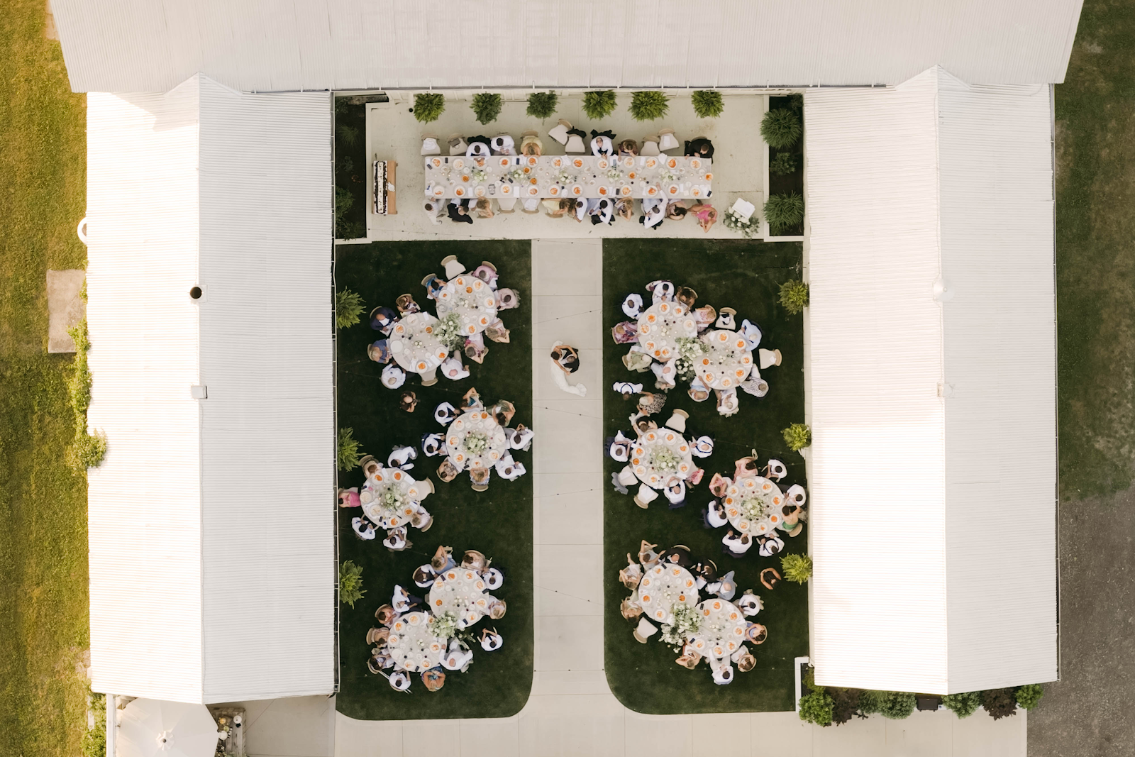 Aerial view of Sorella 1881 courtyard reception — round tables set for guests viewed from above