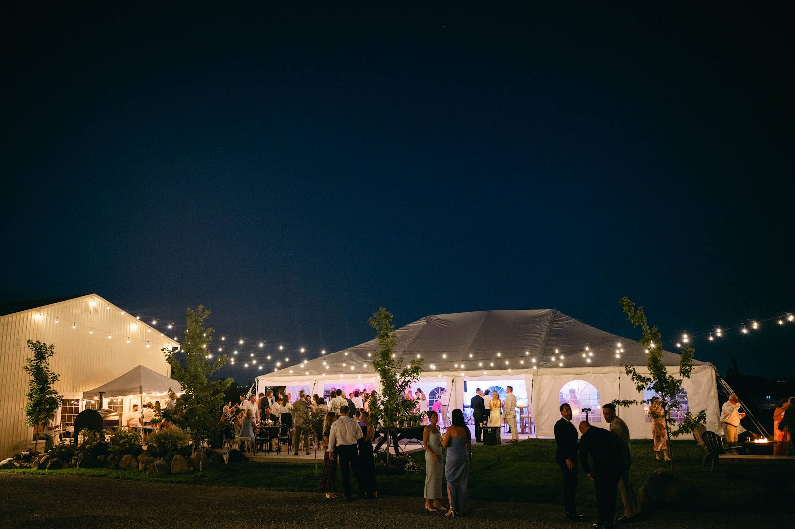 Night reception at Sorella 1881 — glowing Blanc Marquee and string lights under a star-filled sky
